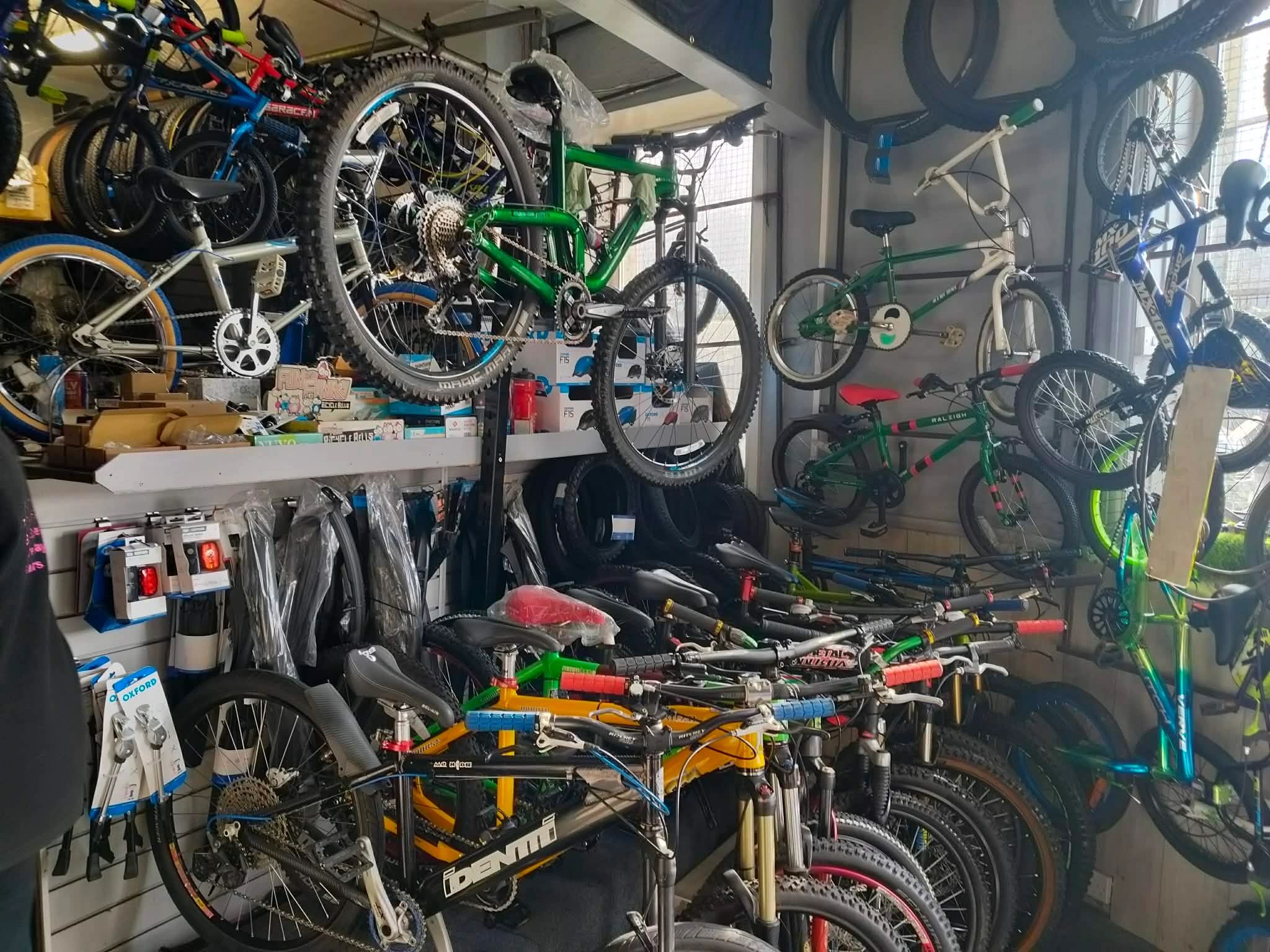 Packed Shay Cycles interior with bikes, wheels and workshop stock
