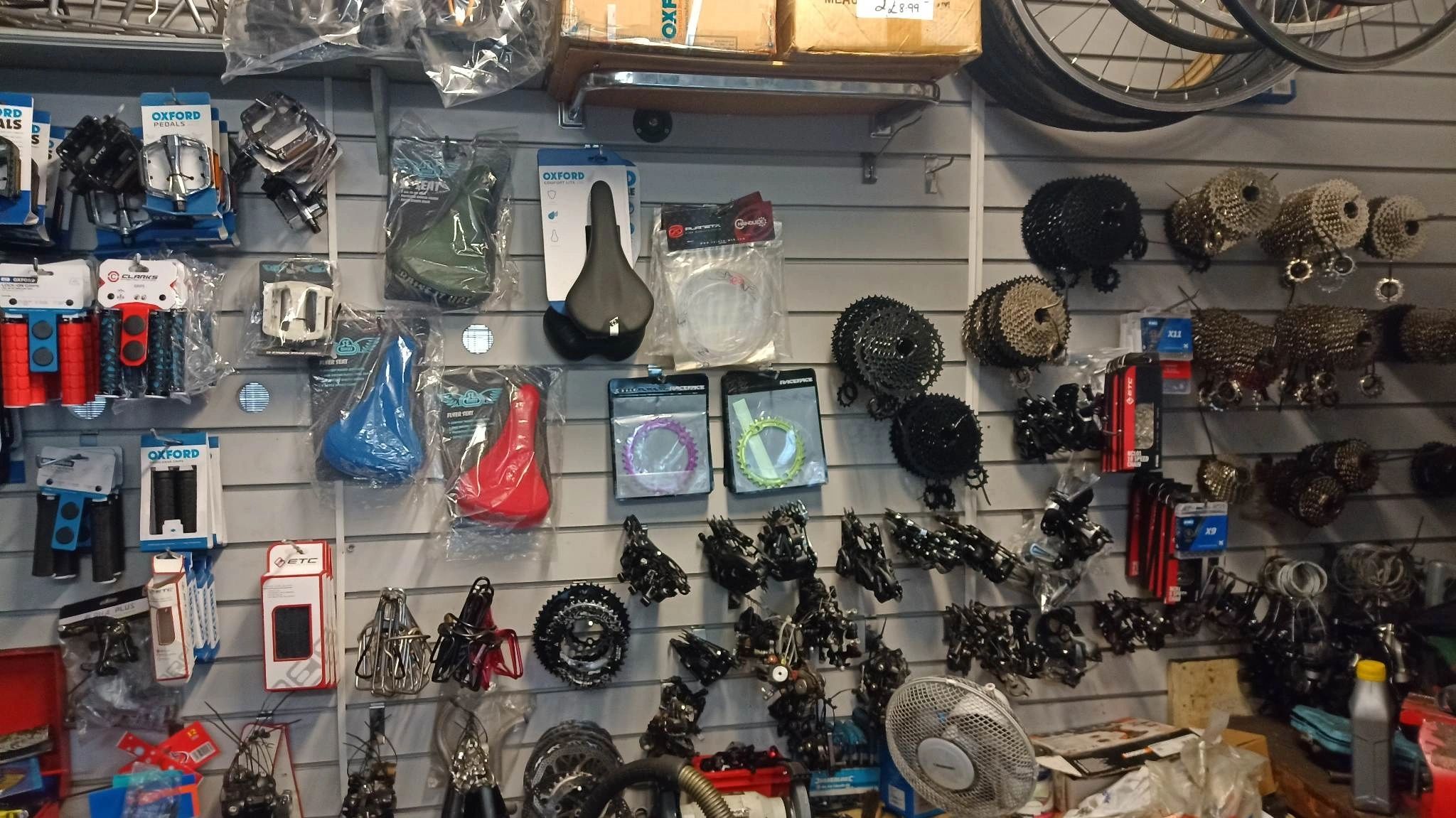 Wall of cycle parts and spares inside Shay Cycles
